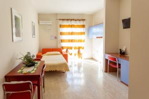 A bed or beds in a room at Il Viandante Catenanuova