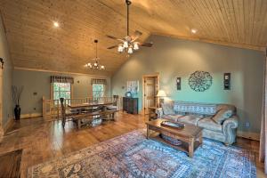 a living room with a couch and a table at Game Room and Mtn Views Family Blue Ridge Retreat in Abshers