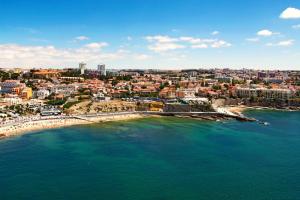 an aerial view of a beach and a city at Beach House Cascais in Estoril