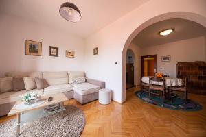 a living room with a couch and a table at Apartman Jadranka in Zadar