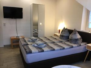 
Ein Bett oder Betten in einem Zimmer der Unterkunft H&E Apartments
