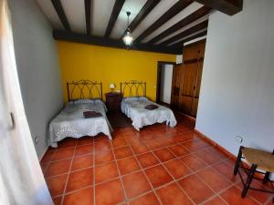 Posteľ alebo postele v izbe v ubytovaní Casa Rural El Caño de Abajo