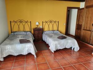 Posteľ alebo postele v izbe v ubytovaní Casa Rural El Caño de Abajo