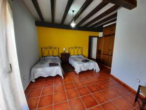 Posteľ alebo postele v izbe v ubytovaní Casa Rural El Caño de Abajo
