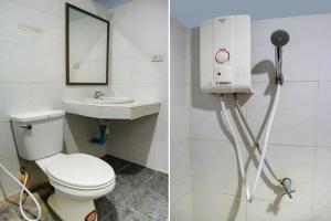 a bathroom with a toilet and a sink at Salatan Resort in Ko Lanta