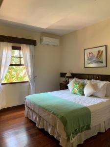 Cama ou camas em um quarto em Hotel Capim Limão Itaipava