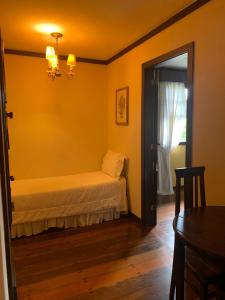 Cama ou camas em um quarto em Hotel Capim Limão Itaipava