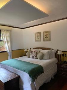 Cama ou camas em um quarto em Hotel Capim Limão Itaipava