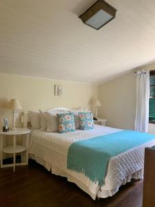 Cama ou camas em um quarto em Hotel Capim Limão Itaipava