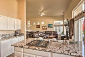 a kitchen with a counter top and a living room at Waterfront Nevada Home with Balcony and Private Dock! in Sparks