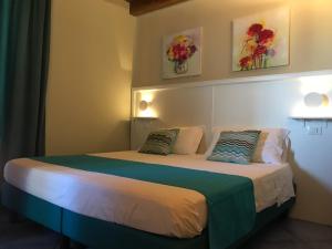 Postel nebo postele na pokoji v ubytování Residenza Vinci Room & Suite