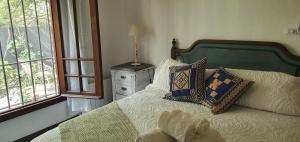Ένα ή περισσότερα κρεβάτια σε δωμάτιο στο Los Tarcos Guest House