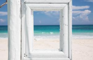 a view from a window of a beach at Coco Tulum Beach Club Hotel in Tulum