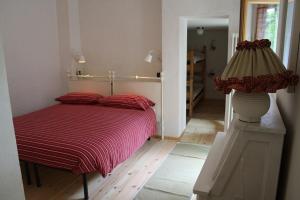 Un pat sau paturi într-o cameră la Rifugio Dalco