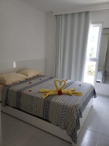 Ένα ή περισσότερα κρεβάτια σε δωμάτιο στο Flat Porto de Galinhas