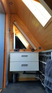 a bathroom in a tiny house with a sink at chalet avec vue imprenable in Bagnères-de-Bigorre