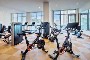 a gym with treadmills and exercise bikes in a building at Hyatt Centric Las Olas Fort Lauderdale in Fort Lauderdale