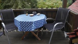 a table with a blue and white polka dot table cloth at Ferienwohnung Kluge in Markische Heide