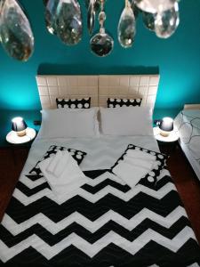 Cama ou camas em um quarto em CasaCasetta Suite Appartamento Indipendente