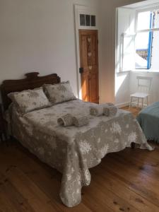Un pat sau paturi într-o cameră la Graciosa Family House