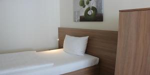 Postel nebo postele na pokoji v ubytování Hotel Barth