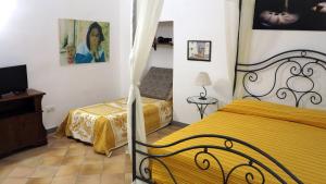 Posteľ alebo postele v izbe v ubytovaní - B&B "Centro Antico" -