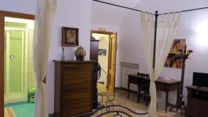Televízia a/alebo spoločenská miestnosť v ubytovaní - B&B "Centro Antico" -