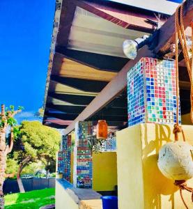 a building with colorful tiles on the side of it at Yanchep Hacienda by the Sea in Yanchep