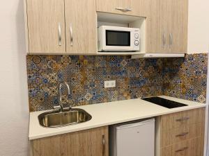 Kuchyňa alebo kuchynka v ubytovaní Apartamentos La Casa del Azafrán