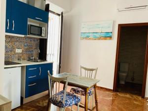 Kuchyňa alebo kuchynka v ubytovaní Apartamentos La Casa del Azafrán