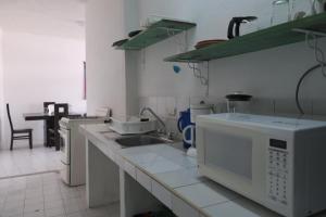 a kitchen with a sink and a counter top at Depa Versalles Puerto Vallarta in Puerto Vallarta