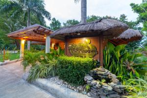 a resort with a sign on the front of it at Bohol Beach Club in Panglao Island +106 photos