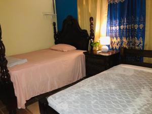 Postelja oz. postelje v sobi nastanitve BlueRock Hostal