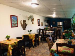 A restaurant or other place to eat at BlueRock Hostal