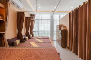 Postel nebo postele na pokoji v ubytování Hotel Amber Pattaya + 37 fotografií