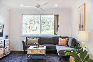a living room with a couch and a window at The Laneway in Mudgee