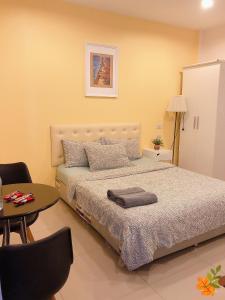 Postel nebo postele na pokoji v ubytování Srinuan Living Hotel