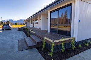 a deck on the side of a building at Dusky Motels in Te Anau