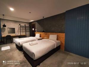Postel nebo postele na pokoji v ubytování Modern Budget Hotel