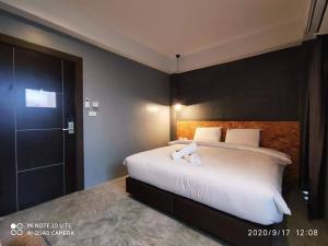 Postel nebo postele na pokoji v ubytování Modern Budget Hotel