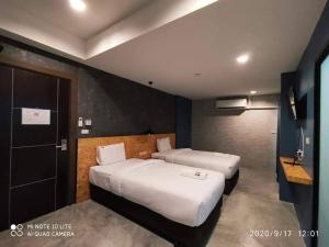 Postel nebo postele na pokoji v ubytování Modern Budget Hotel