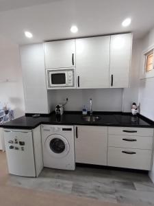 A kitchen or kitchenette at CARPE DIEM Studio