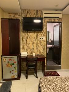 TV a/nebo společenská místnost v ubytování Hoang Yen Nhi Hotel
