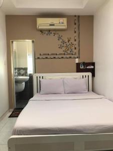 Postel nebo postele na pokoji v ubytování Hoang Yen Nhi Hotel