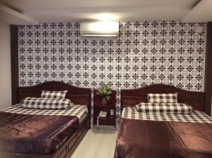 Postel nebo postele na pokoji v ubytování Hoang Yen Nhi Hotel