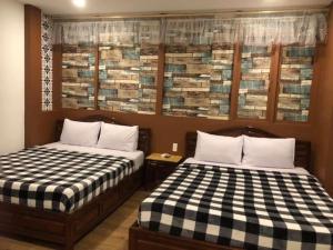 Postel nebo postele na pokoji v ubytování Hoang Yen Nhi Hotel