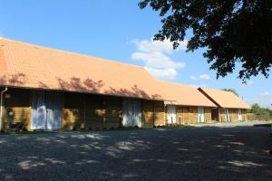 a large building with a brown roof at Garten Chalés in Pomerode