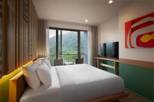 Postel nebo postele na pokoji v ubytování The Peri Hotel Khao Yai