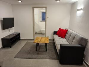 a living room with a couch and a coffee table at wohnung-nummer-2 in Pielenhofen