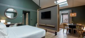 Łóżko lub łóżka w pokoju w obiekcie Hotel Arbaso